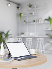 Portable tablet mockup on wood table over blurred modern white desk in co-working space