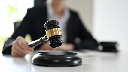 Close-up image, A professional female lawyer with a judge gavel