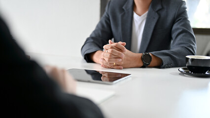 A professional asian businessman having a serious meeting with his worker