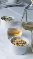 drink with nuts and side dishes