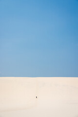 Walking up giant sand dune on Fraser Island K'Gari, Queensland Australia