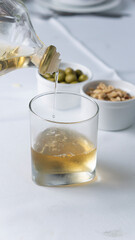 drink with nuts and side dishes