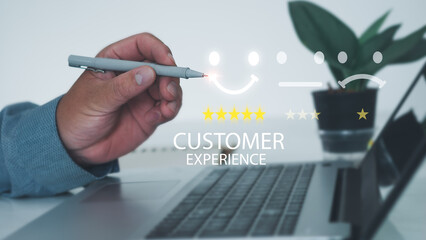 Customer Service Assessment Concept. Businessman pressing face smiley face pen to display emoticons on virtual screens, surveys, polls  questionnaires for user experience or customer satisfaction .