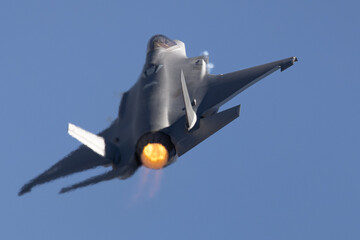 Fototapeta na wymiar Very close tail view of a F-35A Lightning II with afterburner on