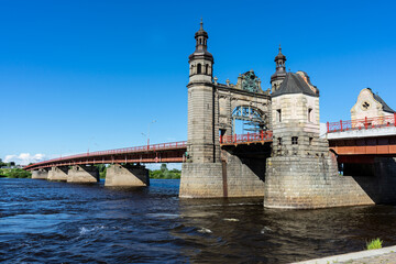 Fototapeta na wymiar The Queen Louise Bridge between Panemune and Sovetsky On a sunny summer day. Selective focus. 