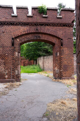 An old red brick military fort. Old tower of red brick. Old military fortification. Selective focus. 