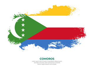 Vintage grunge style Comoros flag with brush stroke effect vector illustration on solid background