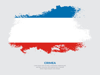 Naklejka premium Vintage grunge style Crimea flag with brush stroke effect vector illustration on solid background