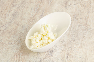 Grained cottage cheese in the bowl