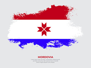 Obraz na płótnie Canvas Vintage grunge style Mordovia flag with brush stroke effect vector illustration on solid background