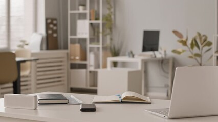 No people slowmo of workplace of hr manager with laptop and notebook on white office desk