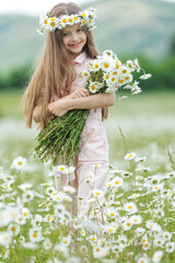 happy girl in the field with flowers. High quality photo