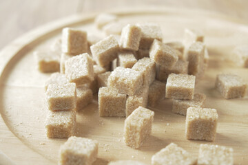 close up of brown sugar cube on table 