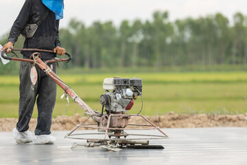 Construction worker are using the machine to polishing on the cement floor