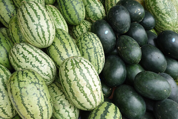 many water melon display for sale at local store 