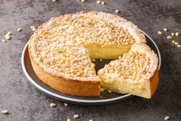 Torta della Nonna Classic Italian dessert closeup in the plate on the table. Horizontal