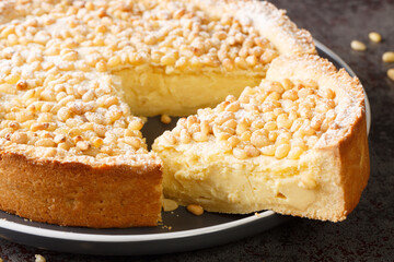 Authentic Italian Torta della Nonna Custard Filled Tart closeup in the plate on the table. Horizontal