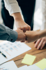 Client shaking hands or Business handshake with insurance agent in office closeup. Business cooperation conceptor sale. Increase of salary.