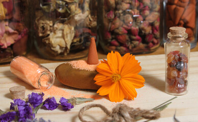 Dried Lavender and Rose Petals on Table With Incense Cones and Crystals