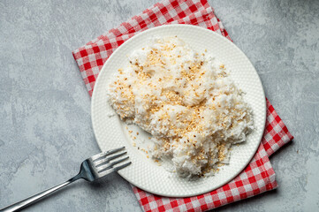 Palitaw is a small, flat, sweet rice cake eaten in the Philippines. They are made from galapong - washed, soaked, and ground malagkit.