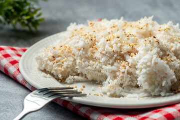 Palitaw is a small, flat, sweet rice cake eaten in the Philippines. They are made from galapong - washed, soaked, and ground malagkit.