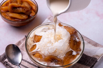 Saging con Hielo- is a famous Filipino dessert and is basically banana in caramel sauce topped with shaved ice and evaporated milk.