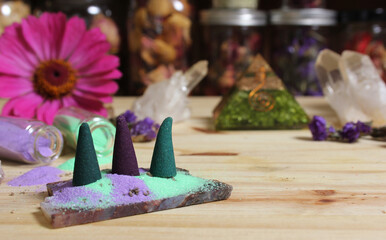Incense Cones on Stone Slab With Crystals and Flowers