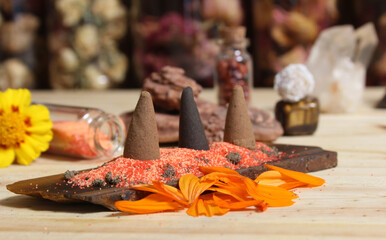 Incense Cones on Stone Slab With Crystals and Flowers