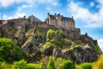 Fototapeta na wymiar Castle hill in Edinburgh with green grass and blue sky, Scotland, UK