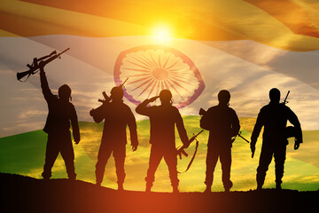 Silhouettes of soldiers on a background of India flag and the sunset or the sunrise. Greeting card for Independence day, Republic Day. India celebration.