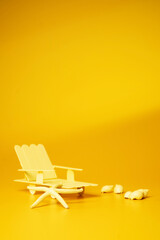 Beach chair on yellow background. - Summer concept.