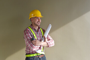 Architect studying room plan Serious civil engineer working on construction site documentation.
