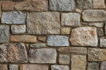 Rustic stone wall close up. Stone wall background