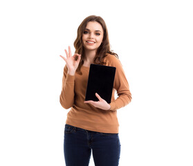 The girl is holding a tablet in her hands. Place for text.