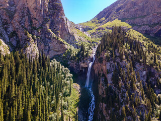 Top view of waterfall and mountains in Kyrgyzstan