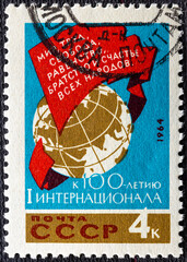 RUSSIA - CIRCA 1964: Postage stamp printed in USSR Russia shows Globe and flag, Centenary of First...