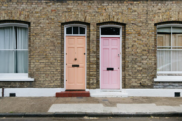 Two identical pink doors in London, England.