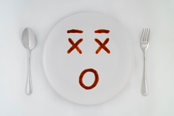 Smiling faces sauce on a white plate.Smiling symbol. Enjoy eating concept.