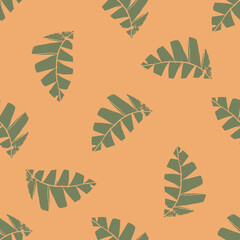 Mono print style scattered leaves seamless vector pattern background. Textured cut out grunge foliage green orange backdrop. Hand crafted painterly design. Organic nature all over print for summer