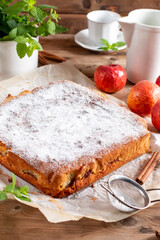 Clasic sponge cake with apples on table, selective focus. Homemade cake