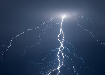Fork lightning striking down during summer storm
