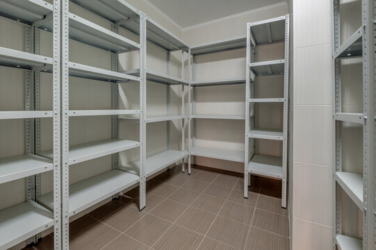 rows of metal shelves in fridge wardrobe. refrigerator for storing large amounts of food