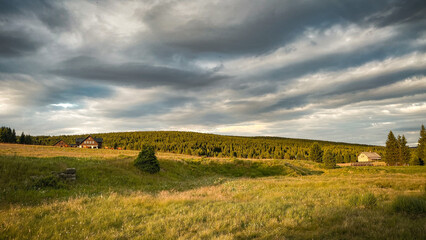Fototapeta premium Mountain meadows in the summer sunset, Hamlet Jizerka, Jizera Mountains, Czech Republic