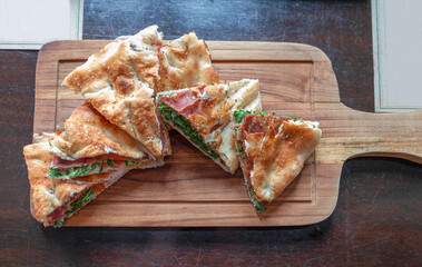 crispy ham pizza puff on table