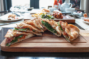 crispy ham pizza puff on table