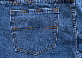 Back pocket of classic jeans. Close-up.