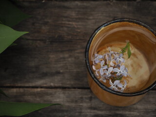 Composition of lilac flowers in a cup 