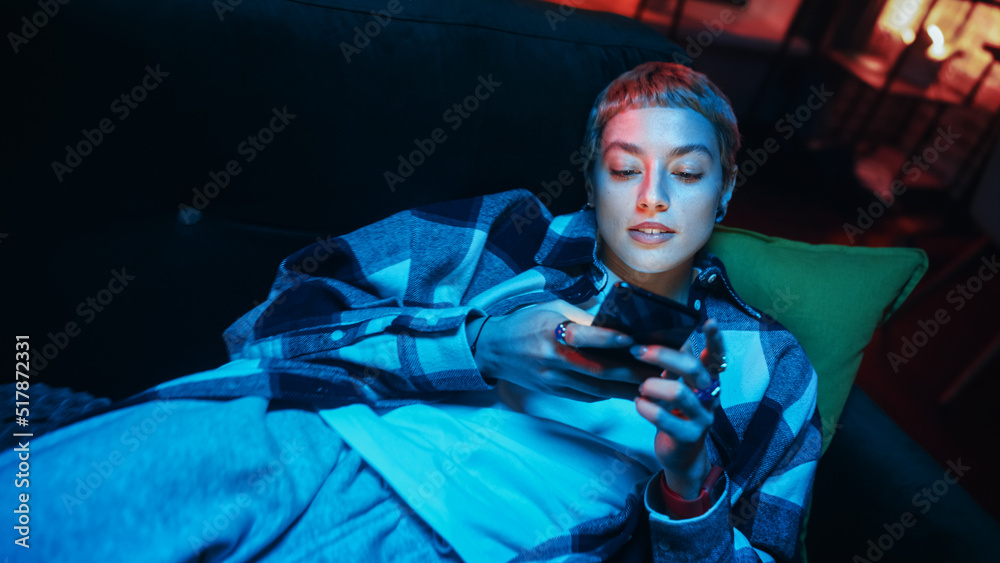 Aufkleber close up portrait of a happy young female with short hair resting on a couch at home while using a s
