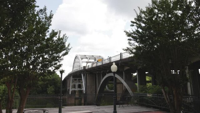 Edmund Pettus bridge in Selma, Alabama with gimbal video walking forward through trees in slow motion.