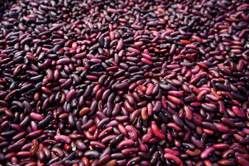 Close up red bean seeds in a bamboo container background